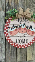 Load and play video in Gallery viewer, Front door hanger, Farmhouse cow door decor, Wood round, shiplap decor, Housewarming gift, Cow wreath, Cow decor, Farm door sign with cows
